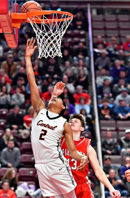 Central York’s Brooklyn Nace, left, takes the ball to the basket while Parkland’s Robbie Ruisch defends during PIAA Class 6A boys’ basketball championship action at Giant Center in Hershey, Saturday, March 23, 2024. Central York would win the game 53-51. (Dawn J. Sagert/The York Dispatch)