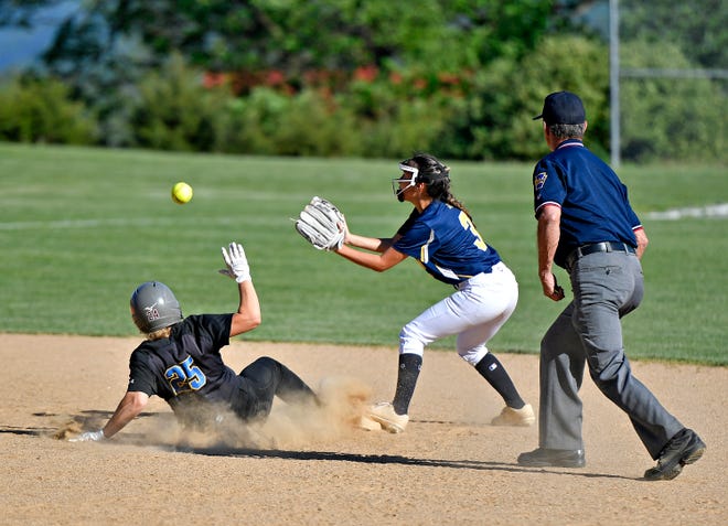 Kennard-Dale’s Kara Golden, left, slides into second as Eastern York’s Rory Hengst looks to catch the ball during softball action at Eastern York High School in Lower Windsor Township, Thursday, May 2, 2024. Kennard-Dale would win the game 14-5. (Dawn J. Sagert/The York Dispatch)