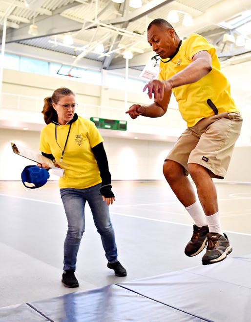 Carl Kennedy, right, of West Manchester Township, competes in the long jump during the Special Olympics Spring Games at Grumbacher Sport and Fitness Center on the York College of Pennsylvania Campus in Spring Garden Township, Saturday, May 4, 2024. (Dawn J. Sagert/The York Dispatch)