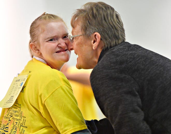 Team York athlete April Gross, left, and her mother Kathy Gross, both of West Manheim Township, share a moment of reaction as April makes her way to the front to accept her award during the Special Olympics Spring Games at Grumbacher Sport and Fitness Center on the York College of Pennsylvania Campus in Spring Garden Township, Saturday, May 4, 2024. (Dawn J. Sagert/The York Dispatch)