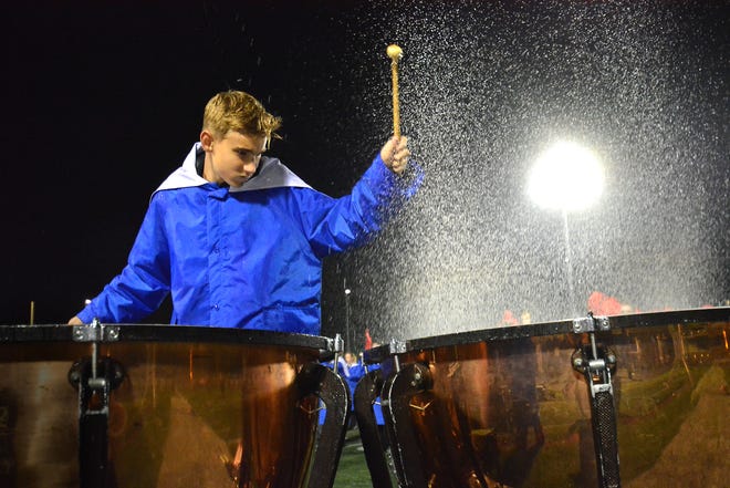 During a rainy Friday night football game at Spring Grove, Ryan Borger creates a storm of his own as he plays the tympani during the halftime show. Spring Grove hosted Dallastown for homecoming on Friday, Oct. 20, 2023. The visiting Wildcats won, 28-21.