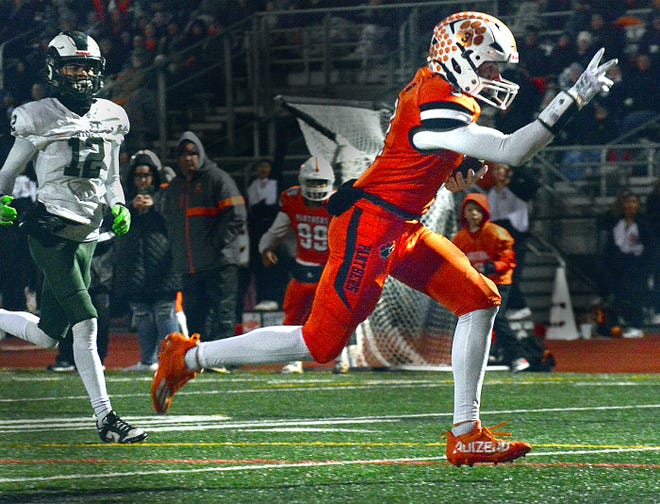 Central York's Ethan Carlos points to the goal line on his way to a touchdown during the Panthers' District 3 Class 6A playoff game against Central Dauphin on Friday, Nov. 10, 2023, in Springettsbury Township. Central York won, 42-34, in a back-and-forth battle.