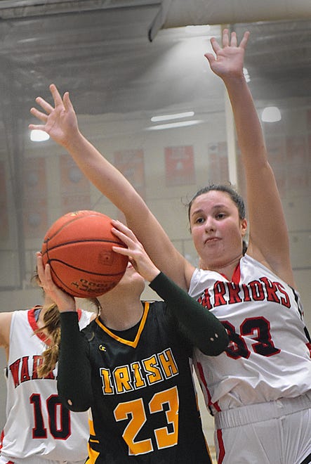 Susquehannock's Lindsey Sweitzer (33) goes up to block a shot from York Catholic's Katie Bullen during Panther Holiday Tournament girls' basketball semifinal action on Wednesday, Dec. 27, 2023, at Central York High School. The Fighting Irish won, 59-38.