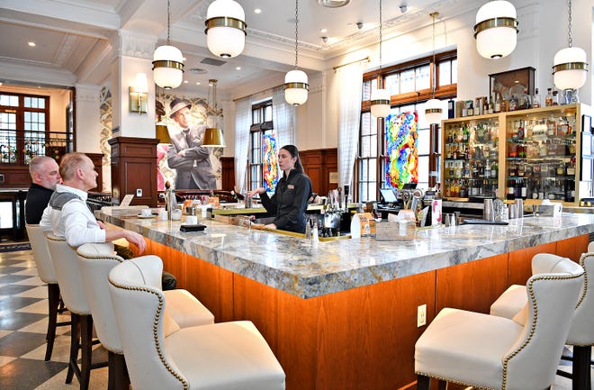 Bartender Morgan Linsdell talks to guests at The Davidson Lobby Bar at The Yorktowne Hotel in York City, Friday, Jan. 26, 2024. The hotel will celebrate its one year anniversary on Jan. 31, since it’s re-opening in 2023. (Dawn J. Sagert/The York Dispatch)