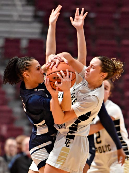 From left, Wyomissing’s Alexis Hardy gets stopped by Delone Catholic’s Jocelyn Robinson and Brielle Baughman during District 3, Class 4A girls’ basketball championship action at Giant Center in Hershey, Thursday, Feb. 29, 2024. Wyomissing would win the game 45-32. (Dawn J. Sagert/The York Dispatch)