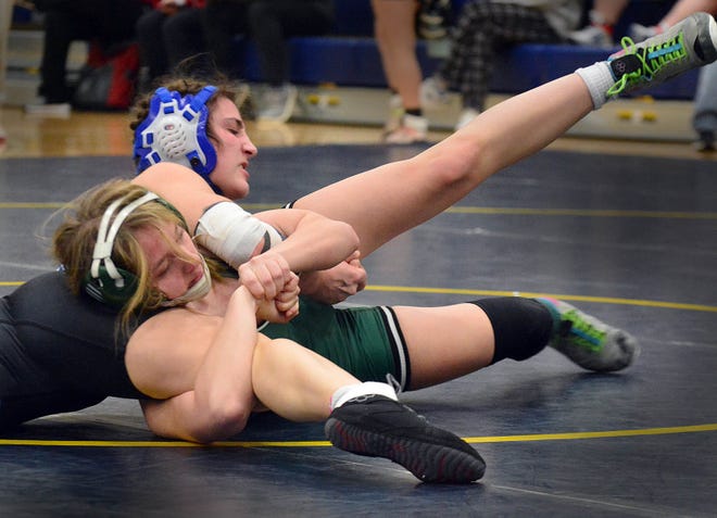 Spring Grove's Ava Dietrich, top, won by 5-3 decision over Sophia Adams of Carlisle at 124 pounds at the PIAA District 3 girls' wrestling tournament at Penn Manor High School in Millersville on Saturday, March 2, 2024.