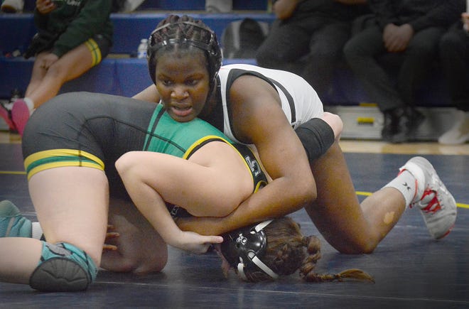York Suburban's Angela Imorhoa, top, won by 9-7 decision over Maya Landefeld of Central Dauphin in the 170-pound class at the PIAA District 3 girls' wrestling tournament at Penn Manor High School in Millersville on Saturday, March 2, 2024.