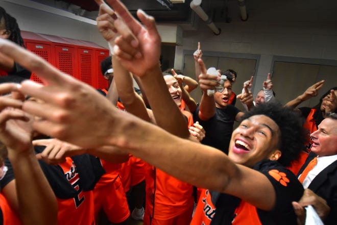 Central York boys' basketball celebrates in the locker room after defeating Reading, 79-65, in the PIAA Class 6A semifinals on Tuesday, March 19, 2024, at Warwick High School in Lilitz. The Panthers advanced to the state final for the first time in program history.