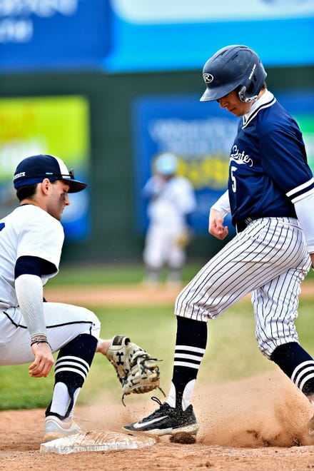 Penn State York Ryan Schubert, left, moves to tag out Penn State Scranton’s Jake Leonori in a pickoff attempt at first during baseball action at WellSpan Park in York City, Friday, March 22, 2024. Penn State York would win the first game in the afternoon doubleheader 4-1. (Dawn J. Sagert/The York Dispatch)