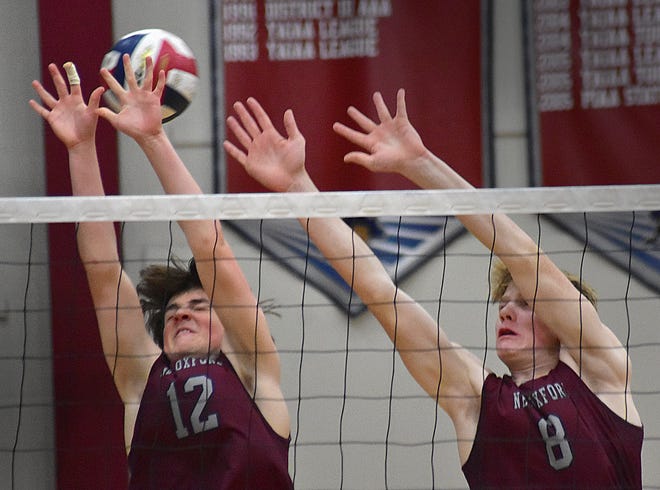 New Oxford's Evan Strausbaugh (12) and Tanner Haugh (8) rise above the net against Kennard-Dale during York-Adams League boys' volleyball action Thursday, April 11, 2024, at New Oxford. The Colonials swept the Rams, 3-0.