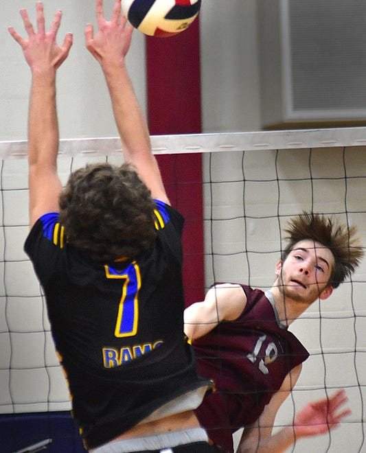 New Oxford's Jackson Wolfe (19) attacks against Kennard-Dale's Nicholas Gaumer (7) during York-Adams League boys' volleyball action Thursday, April 11, 2024, at New Oxford. The Colonials swept the Rams, 3-0.