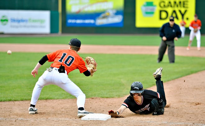 Central York’s Ethan Hall, left, looks to catch the ball as South Western’s Travis Ridgely safely slides back to first in a pickoff attempt during the Crushing Cancer baseball fundraising event at WellSpan Park in York City, Friday, April 12, 2024. South Western would win the game 7-2. (Dawn J. Sagert/The York Dispatch)