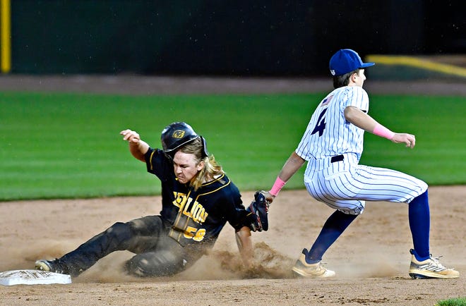 Dallastown’s Kaden Beaverton, right, looks to tag out Red Lion’s Steven Bowman as he slides into second during the Crushing Cancer baseball fundraising event at WellSpan Park in York City, Friday, April 12, 2024. (Dawn J. Sagert/The York Dispatch)