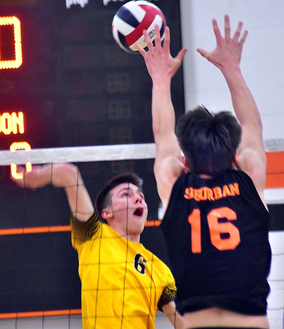 Red Lion's Blake Downs (6) rises up for an attack against York Suburban's Truett Miller (16) during York-Adams League boys' volleyball action Wednesday, April 17, 2024, at York Suburban High School. The visiting Lions earned a 3-0 sweep of the Trojans.