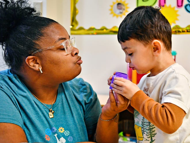 Assistant group supervisor Mahiya Jones, left, holds a make-believe hot cup of juice which is cooled by a child in the daycare program at WeeConnect Early Learning Center in Spring Garden Township, Tuesday, April 16, 2024. With nine children currently enrolled in the inclusive daycare program, the nonprofit is raising funds to expend into a space that would allow 30-40 children to be enrolled, many of whom are on a waiting list. (Dawn J. Sagert/The York Dispatch)