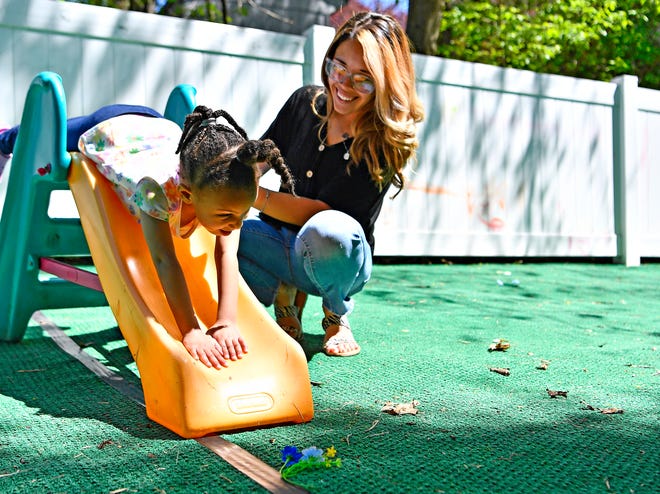 WeeConnect Early Learning Center Director Tiara Ritter, right, is shown with a child in the outdoor play area at WeeConnect in Spring Garden Township, Tuesday, April 16, 2024. (Dawn J. Sagert/The York Dispatch)