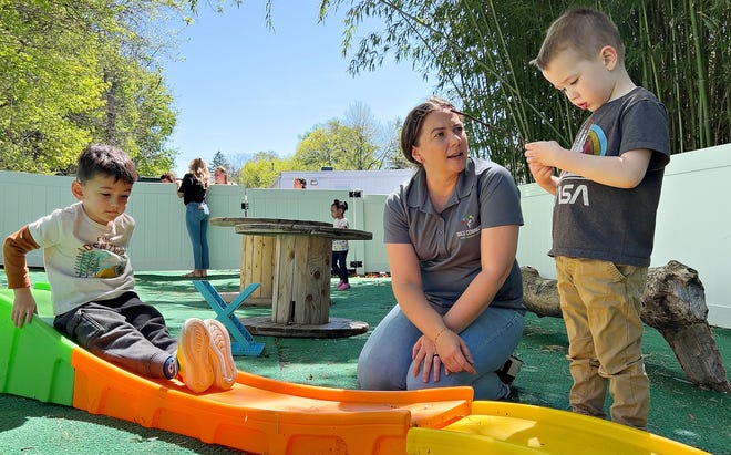 Board member Liz Jones, center, of Springfield Township, is shown in the outdoor play area with two of the nine children enrolled at WeeConnect Early Learning Center in Spring Garden Township, Tuesday, April 16, 2024. (Dawn J. Sagert/The York Dispatch)