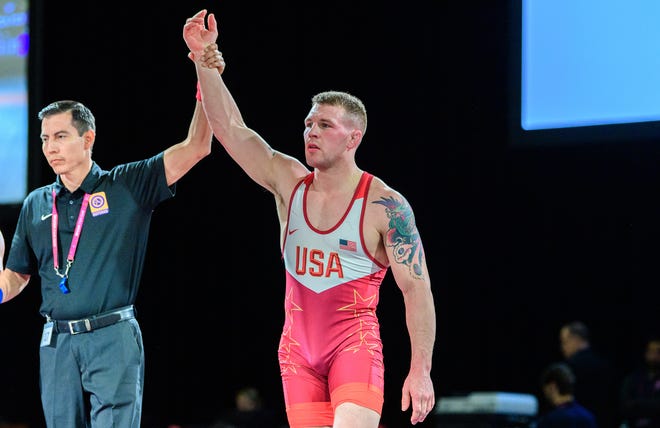 Kennard-Dale High graduate John Stefanowicz, right, has his hand raised after he won the 82-kilogram (181-pound) gold medal at the 2020 Pan Am Games in March. Stefanowicz is ranked No. 1 in his weight class for Team USA.