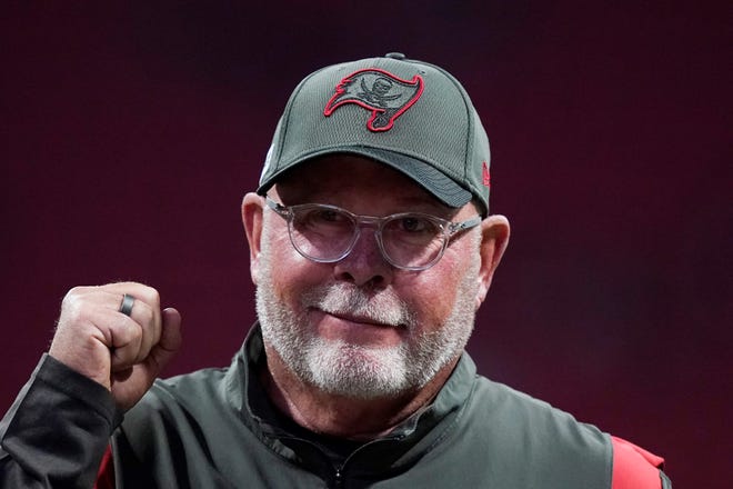 FILE - Tampa Bay Buccaneers coach Bruce Arians walks along the sideline before the team's NFL football game against the Atlanta Falcons on Dec. 5, 2021, in Atlanta. Arians has decided to retire as coach of the Buccaneers and move into a front-office role with the team, it was announced Wednesday night, March 30. Arians, who will turn 70 this coming season, coached the Bucs to the Super Bowl title in the 2020 season â€” Tom Bradyâ€™s first with Tampa Bay. (AP Photo/Brynn Anderson, File)