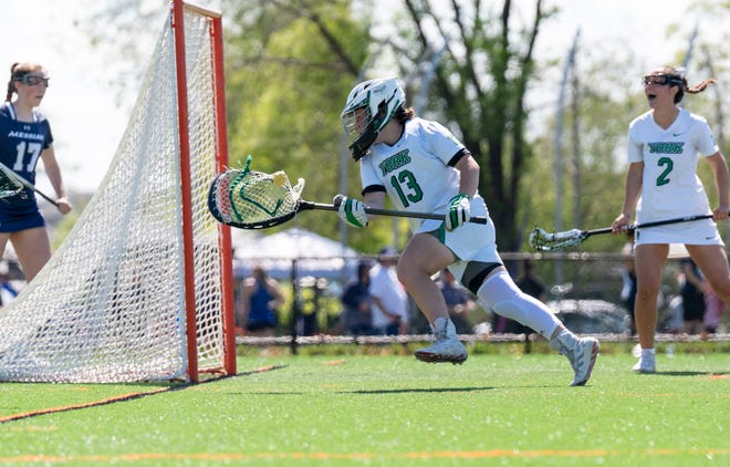 York College's Bella Garabo (13) against Messiah during the Commonwealth Women's Lacrosse Final in York on Saturday, May 6, 2023.